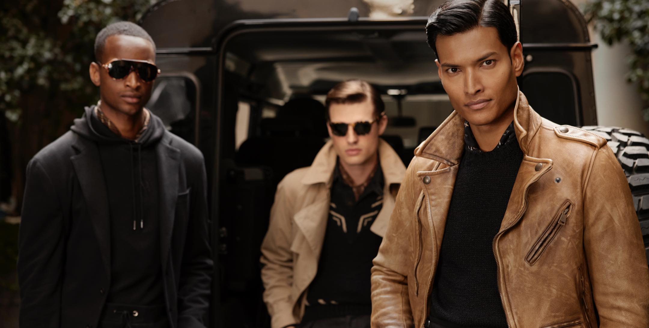 Men wear Purple Label outerwear and apparel.