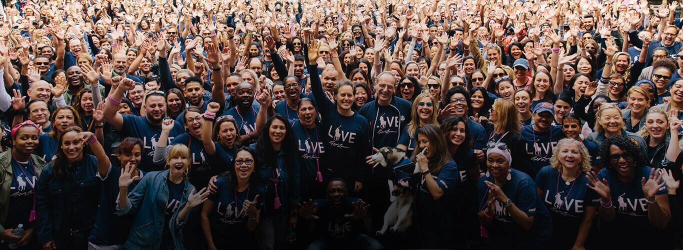 Ralph Lauren employees in navy Pink Pony tees at Pink Pony Walk.